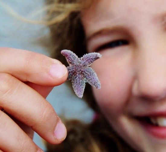 Young Girl with Starfish Sea Star